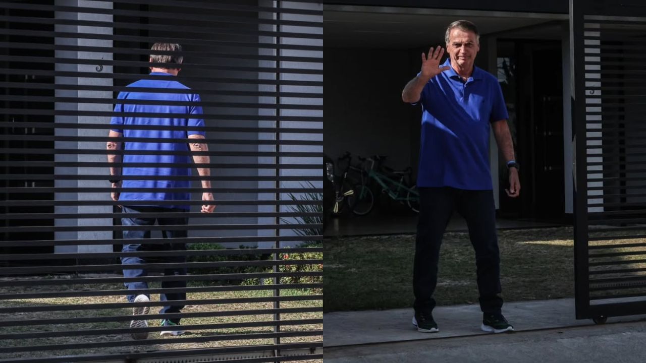 Jair Bolsonaro, em prisão domiciliar, em frente ao portão de sua casa e acenando